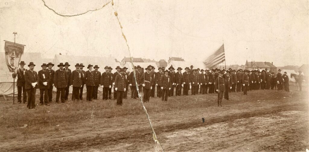 Civil War veterans of St. Peter's A. K. Skaro Post 37 of the Grand Army of the Republic with their banner. Gideon S. Ives, the post commander, is in front. Circa 1895.