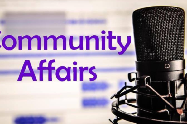 A close-up of a black microphone with a pop filter and stand on the right, with the words "Community Affairs" in bold purple text on the left. The background is blurred but appears to show a digital sound wave pattern.