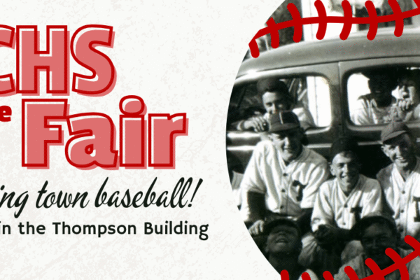 Banner promoting "NCHS at the Fair" with event dates August 7-10 in the Thompson Building. Includes a black-and-white photo of a baseball team and red stitching border resembling a baseball. Text highlights town baseball.