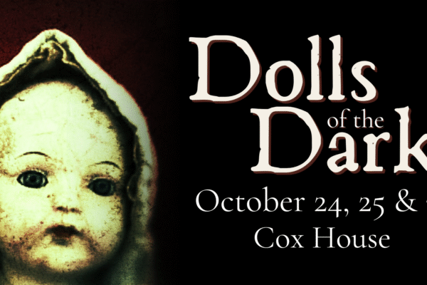 An old doll with a pale face and hood is on the left side. On the right, text reads: "Dolls of the Dark, October 24, 25 & 31, Cox House" on a black background.