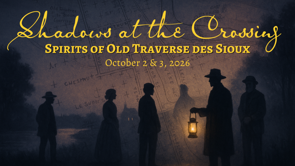Silhouetted figures in old-fashioned hats and coats stand in front of a map background. One person holds a lantern, their face awash in ghostly light. Text reads: “Shadows at the Crossing: Spirits of Old Traverse des Sioux, October 2 & 3, 2026.”.